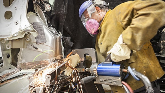 Collision Center Technician Repairing Vehicle | Orem Toyota ES in Orem UT